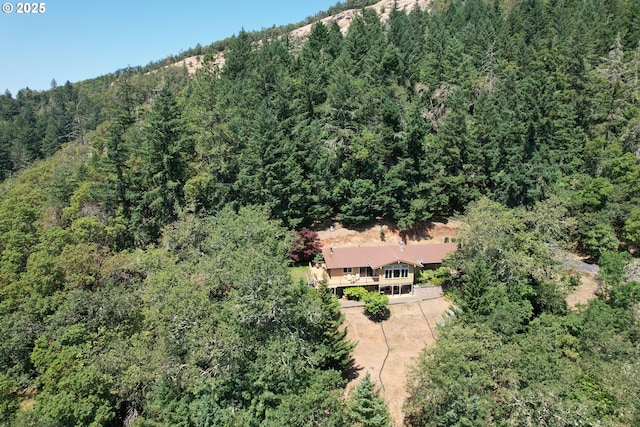 1056 NE Orchard Dr, Myrtle Creek, OR 97457 - aerial view of property and surrounding area featuring a heavily wooded area