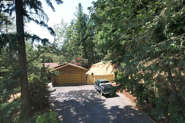 1056 NE Orchard Dr, Myrtle Creek, OR 97457 - view of side of property with asphalt driveway and a garage