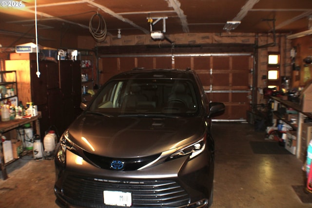 1056 NE Orchard Dr, Myrtle Creek, OR 97457 - garage featuring a garage door opener and a workshop area