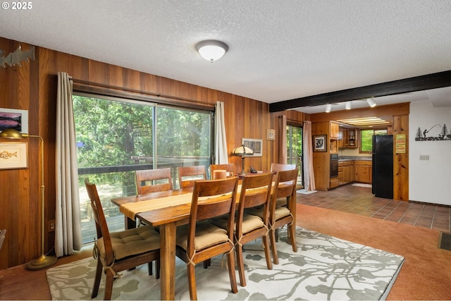 70198 E Barlow Trail Rd, Rhododendron, OR 97049 - dining space with wooden walls, a textured ceiling, and light tile patterned floors