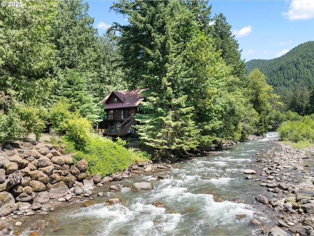 70198 E Barlow Trail Rd, Rhododendron, OR 97049 - water view featuring a heavily wooded area