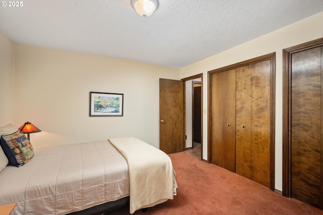 70198 E Barlow Trail Rd, Rhododendron, OR 97049 - bedroom with carpet floors, two closets, and a textured ceiling