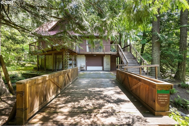 70198 E Barlow Trail Rd, Rhododendron, OR 97049 - view of front of home featuring stairway, driveway, a garage, and a deck