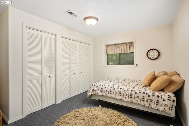 70198 E Barlow Trail Rd, Rhododendron, OR 97049 - carpeted bedroom featuring multiple closets