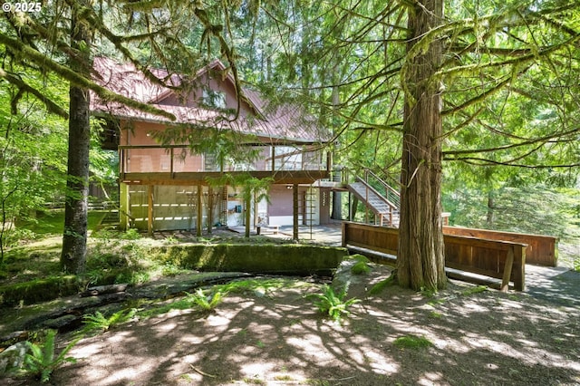 70198 E Barlow Trail Rd, Rhododendron, OR 97049 - back of property featuring stairway, a wooden deck, and a patio