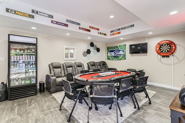 recreation room with light wood-style floors, baseboards, recessed lighting, and wine cooler