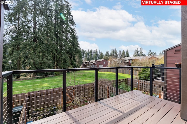 wooden deck with a yard