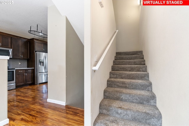stairway with wood finished floors