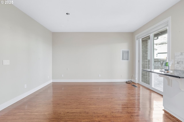 unfurnished room featuring light hardwood / wood-style flooring