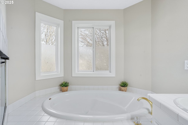 bathroom featuring tiled tub