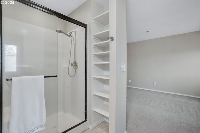 bathroom with a shower with shower door