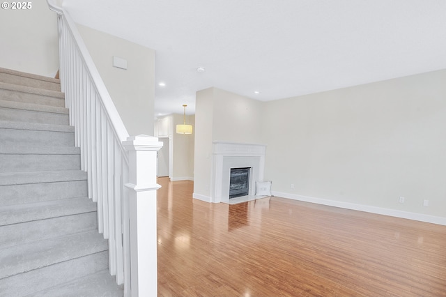 unfurnished living room featuring light hardwood / wood-style floors