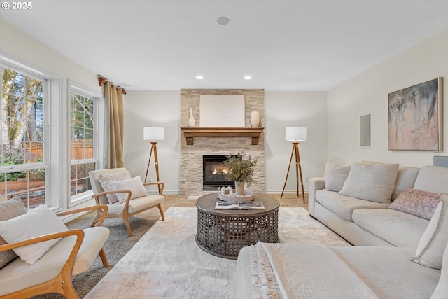 living room featuring carpet, recessed lighting, a fireplace, and baseboards