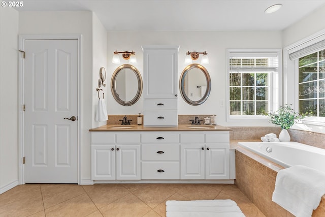 bathroom with tile patterned flooring, double vanity, and a sink