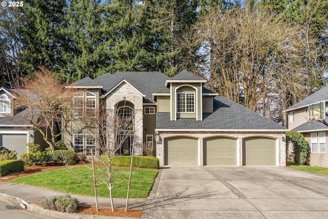 traditional-style home featuring a front lawn, concrete driveway, a shingled roof, a garage, and brick siding