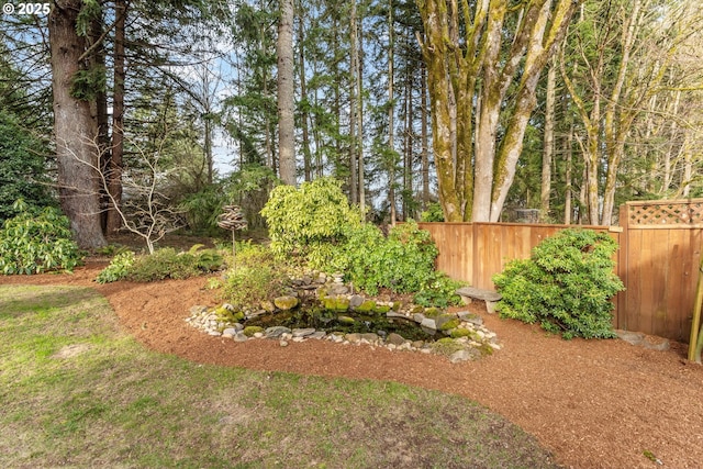 view of yard with fence