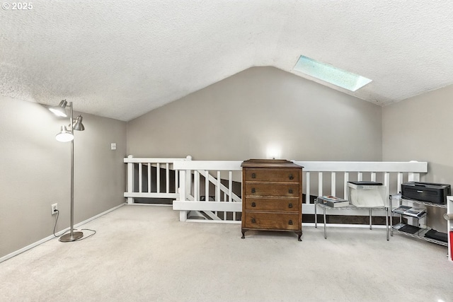 14938 SW 109th Ave, Portland, OR 97224 - additional living space with a skylight, carpet flooring, vaulted ceiling, a textured ceiling, and baseboards