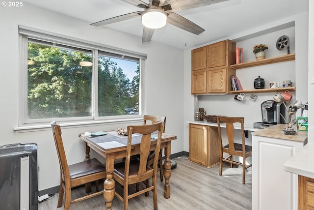 14938 SW 109th Ave, Portland, OR 97224 - dining space featuring plenty of natural light, light wood-style flooring, a ceiling fan, and heating unit
