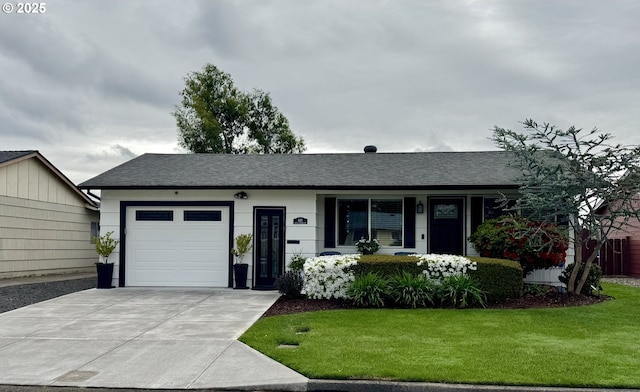 440 S Cascade Dr, Woodburn, OR 97071 - ranch-style home with a garage, a front lawn, driveway, a shingled roof, and covered porch