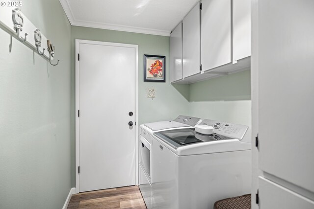 440 S Cascade Dr, Woodburn, OR 97071 - washroom with cabinet space, independent washer and dryer, light wood finished floors, ornamental molding, and baseboards