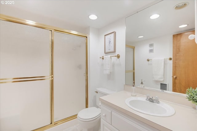 bathroom featuring a shower stall, toilet, and recessed lighting