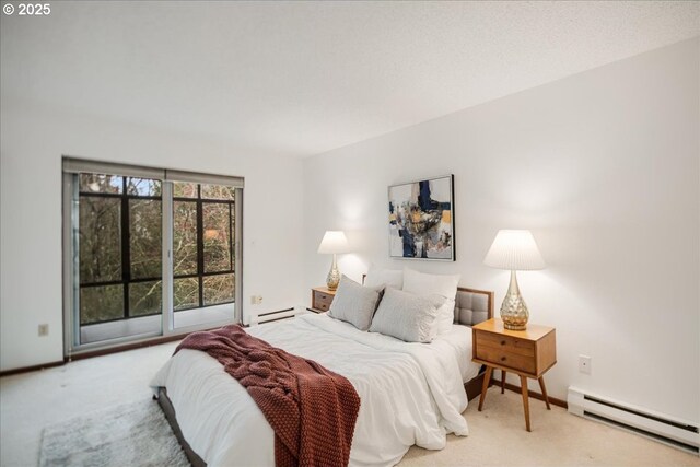 bedroom with a baseboard heating unit, light carpet, baseboard heating, and access to outside