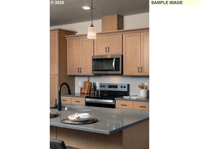 kitchen with appliances with stainless steel finishes, sink, backsplash, hanging light fixtures, and a textured ceiling