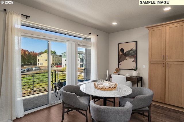 dining space with dark hardwood / wood-style flooring