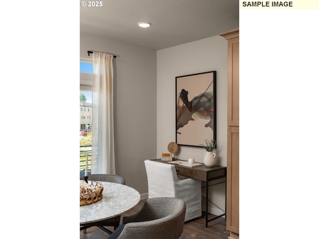 dining area with hardwood / wood-style floors