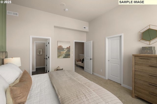 bedroom featuring light colored carpet