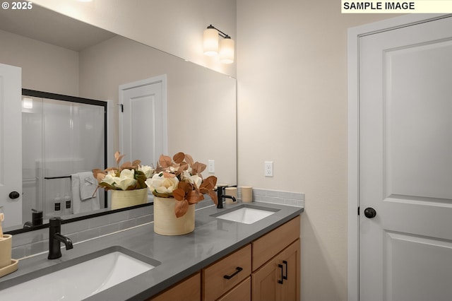 bathroom with vanity and an enclosed shower