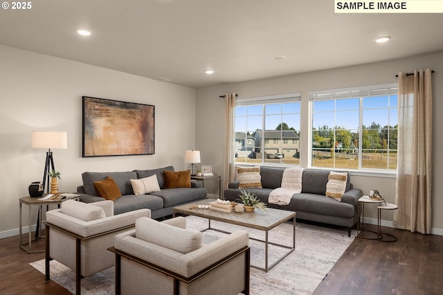 living room featuring dark hardwood / wood-style floors and a wealth of natural light