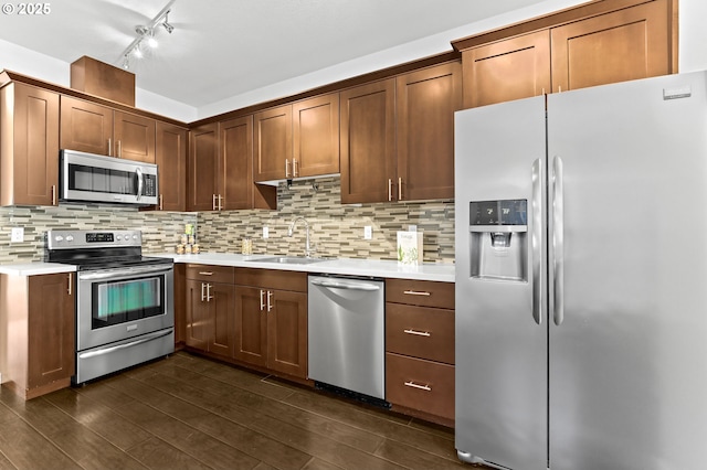 3963 N Montana Ave Unit 1, Portland, OR 97227 - kitchen with stainless steel appliances, a sink, light countertops, and decorative backsplash