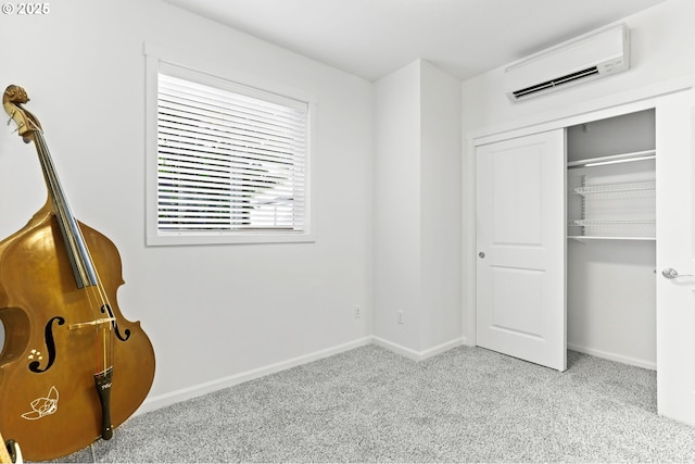 3963 N Montana Ave Unit 1, Portland, OR 97227 - unfurnished bedroom with a wall unit AC, carpet floors, a closet, and baseboards