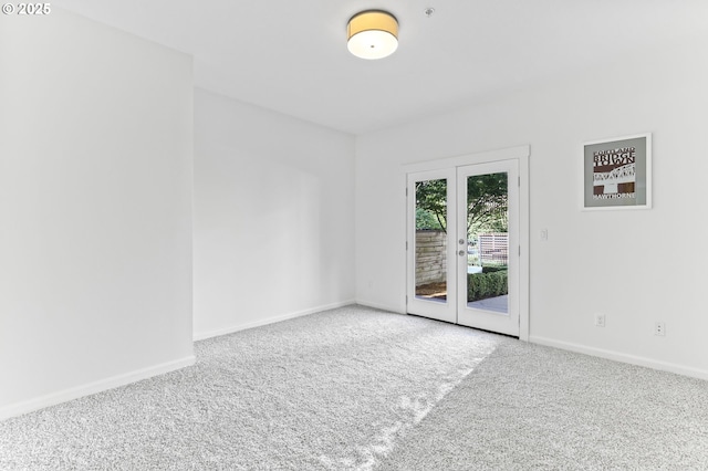 3963 N Montana Ave Unit 1, Portland, OR 97227 - carpeted empty room featuring baseboards and french doors