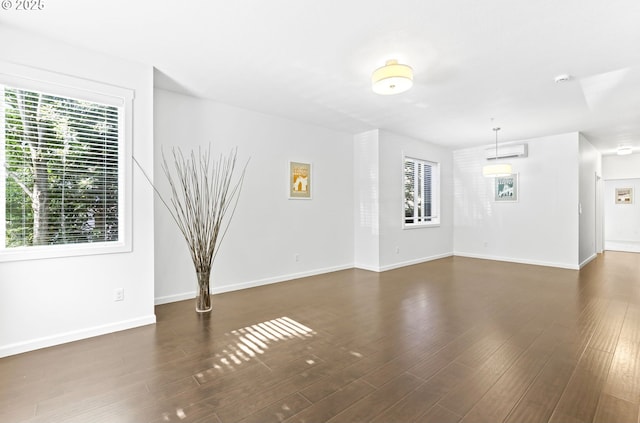 3963 N Montana Ave Unit 1, Portland, OR 97227 - unfurnished living room with healthy amount of natural light, wood finished floors, and baseboards