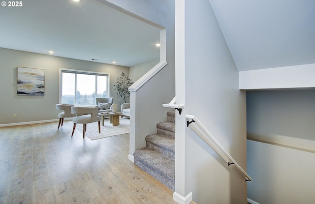 stairway featuring wood-type flooring