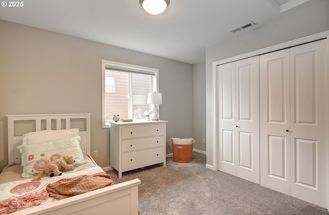 carpeted bedroom featuring a closet