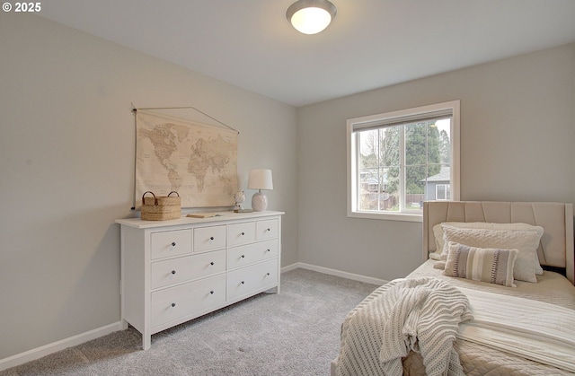 bedroom featuring light colored carpet