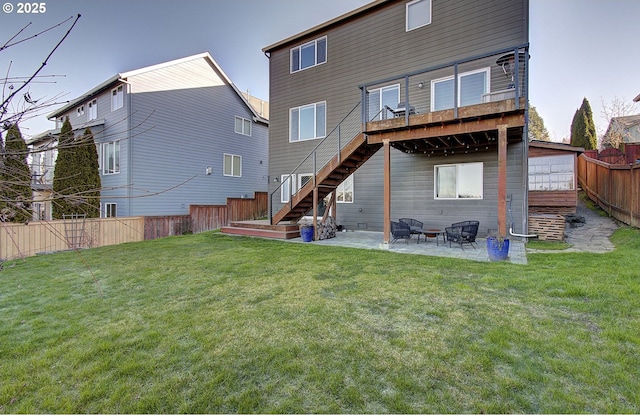 rear view of property featuring a yard and a patio