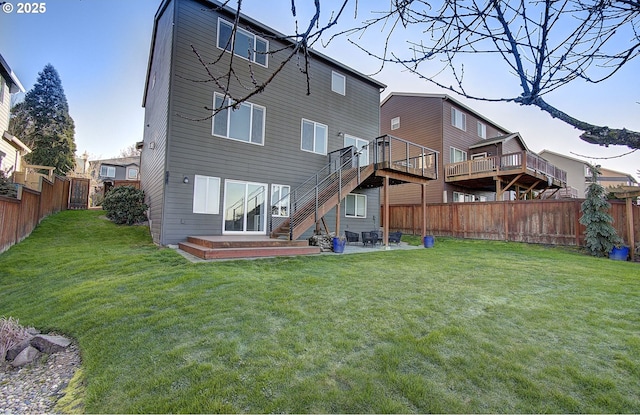 back of house with a patio, a deck, and a lawn