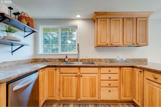 kitchen featuring light stone counters, sink, light brown cabinetry, and dishwasher