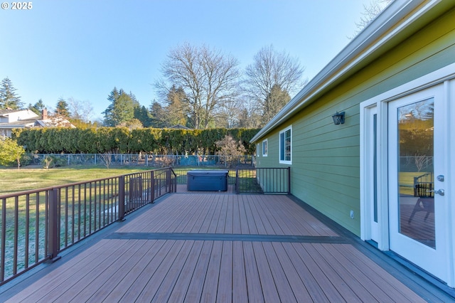 wooden terrace with a lawn