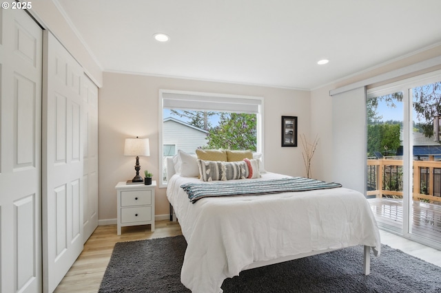 bedroom with crown molding, access to exterior, light wood finished floors, and recessed lighting