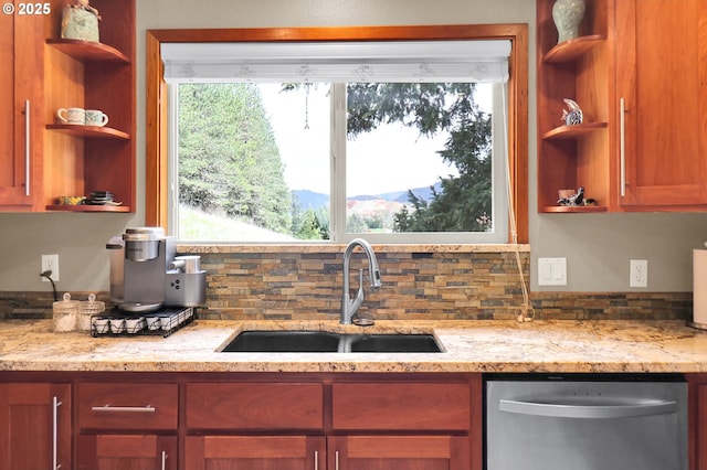 kitchen featuring open shelves, dishwasher, and a sink