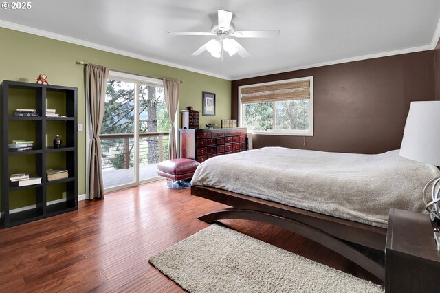 bedroom with access to outside, crown molding, multiple windows, dark wood finished floors, and a ceiling fan
