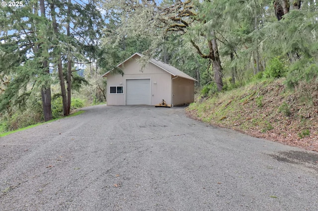 detached garage featuring driveway