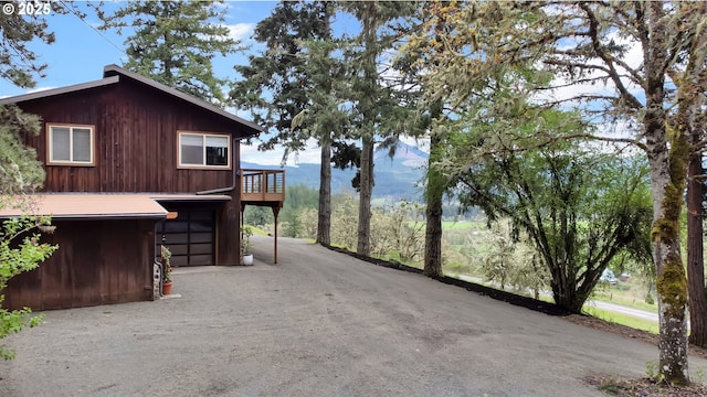 view of home's exterior featuring driveway and a garage