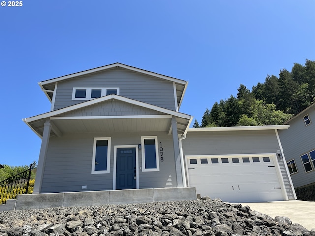 1028 Forest Heights St, Sutherlin, OR 97479 - view of front of home featuring an attached garage, concrete driveway, and a porch