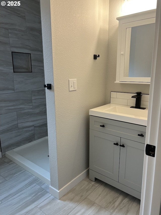 1028 Forest Heights St, Sutherlin, OR 97479 - full bathroom featuring vanity, a stall shower, and a textured wall